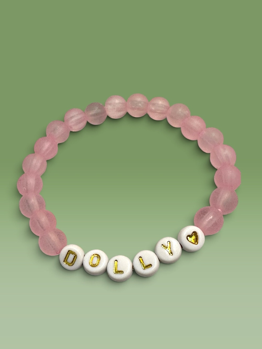 Pink Frosted Dolly Parton handmade beaded bracelet with Gold Lettering